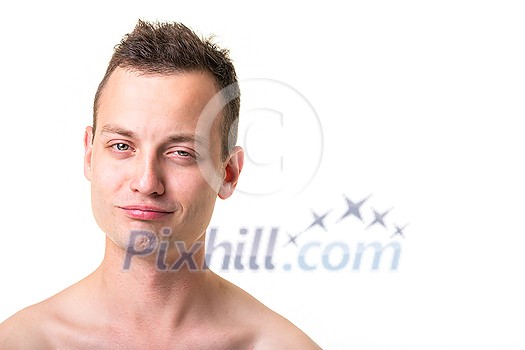 Portrait of a handsome young man on white background, making funny faces Portrait of a handsome young man on white background, making funny faces