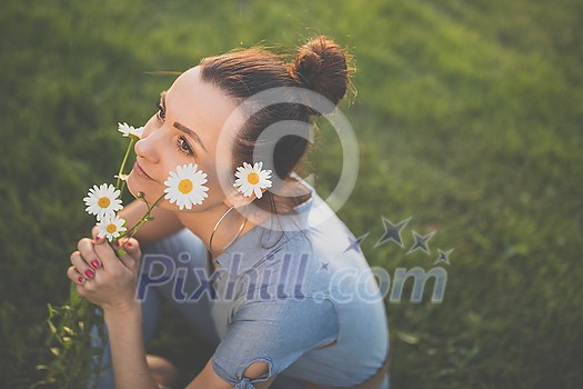 Pretty, young woman in a lovely park, enjoying some free time on a weekend (color toned image) Pretty, young woman in a lovely park, enjoying some free time on a weekend (color toned image)