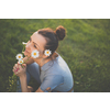 Pretty, young woman in a lovely park, enjoying some free time on a weekend (color toned image)