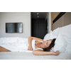 Beautiful young woman sleeping in bed
