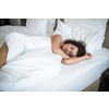 Beautiful young woman sleeping on bed at bedroom