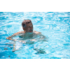 Senior man in his home swimming pool, enjoying the deserved retirement