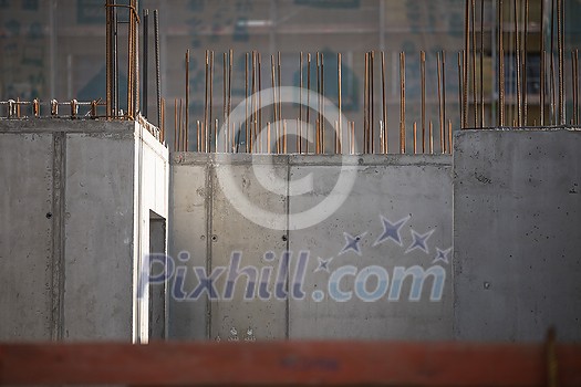 Construction site with a concrete slab and walls reinforced with steel Construction site with a concrete slab and walls reinforced with steel