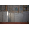 Construction site with a concrete slab and walls reinforced with steel