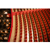 Beautiful of the empty parterre and part of the orchestra pit in the theatre concert hall of Vienna State Opera auditorium with red seats in the rows without people in Vienna, Austria.