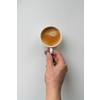 Man holding tasty aromatic cup of coffee on white background, cropped image