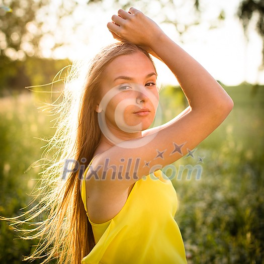 Portrait of young woman with radiant clean outdoor on a spring/summer sunny day Portrait of young woman with radiant clean outdoor on a spring/summer sunny day