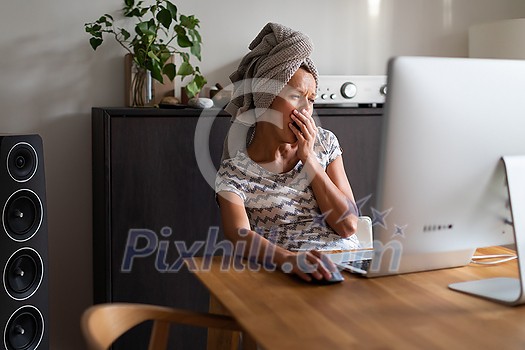 Home office/Remote work series - Pretty, young woman working at her computer from home Home office/Remote work series - Pretty, young woman working at her computer from home