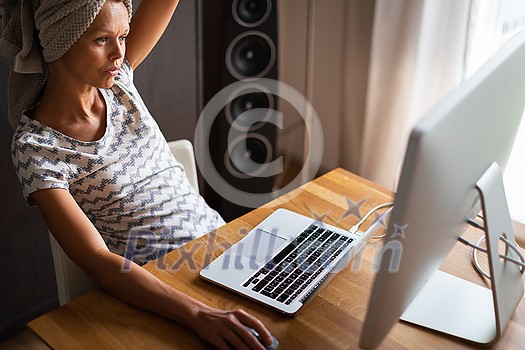 Home office/Remote work series - Pretty, young woman working at her computer from home Home office/Remote work series - Pretty, young woman working at her computer from home