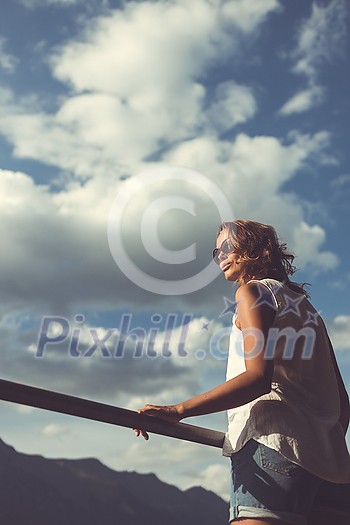Portrait of a pretty, young woman outdoors in warm evening sunlight Portrait of a pretty, young woman outdoors in warm evening sunlight