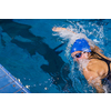 Female swimmer in an indoor swimming pool - doing crawl (shallow DOF)