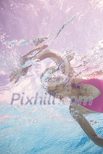 Young woman in a swimming pool enjoying days of summer Young woman in a swimming pool enjoying days of summer