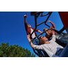 portrait of group young happy people enjoying beautiful sunny day while driving a off road buggy car on mountain nature