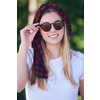 Outdoor portrait of beautiful, emotional, young woman in sunglasses. Soft background. Copy space