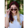 Outdoor portrait of beautiful, emotional, young woman in sunglasses. Soft background. Copy space