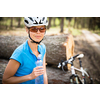 Pretty, young female biker outdoors on her mountain bike (shallow DOF; selective focus)
