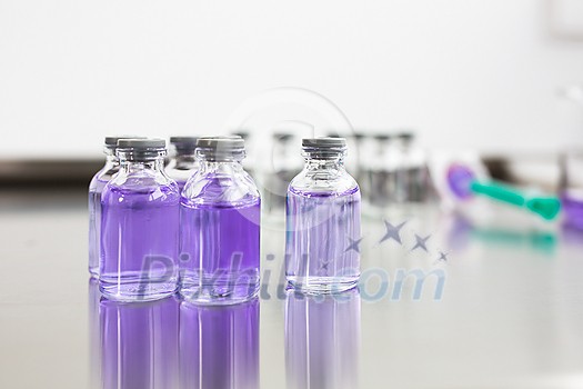 Flasks with liquids in a lab - Pharmaceutical industry factory and production laboratory (color toned image; shallow DOF) Flasks with liquids in a lab - Pharmaceutical industry factory and production laboratory (color toned image; shallow DOF)