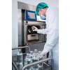 Flasks with liquids in a lab - Pharmaceutical industry factory and production laboratory (color toned image; shallow DOF), COVID vaccine production concept