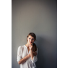 Pensive young woman in casual clothing with copy space. Successful smiling woman, pondering an idea.