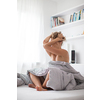 Pretty, young woman being in a bad place - struggling to get out of bed in the morning during COVID pandemics, lacking motivation and purpose