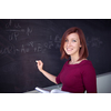 Pretty, young college student writing on the chalkboard, blackboard during a math class