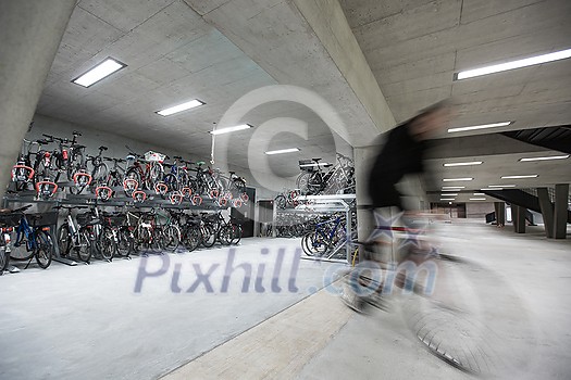 Motion blurred people - figures in an underpassage getting to their workplace in the morning. Busy city business life. Motion blurred people - figures in an underpassage getting to their workplace in the morning. Busy city business life.
