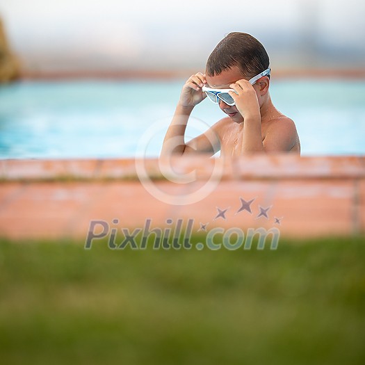Cute little boy in a swimming pool Cute little boy in a swimming pool