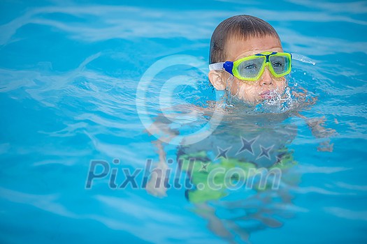 Cute little boy in a swimming pool Cute little boy in a swimming pool
