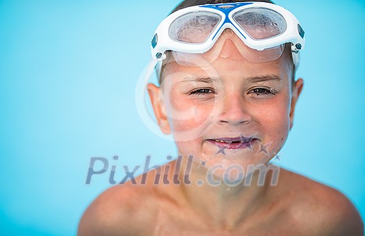 Cute little boy in a swimming pool Cute little boy in a swimming pool