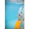 Gorgeous young woman in a pool, jumping and diving underwater, having fun