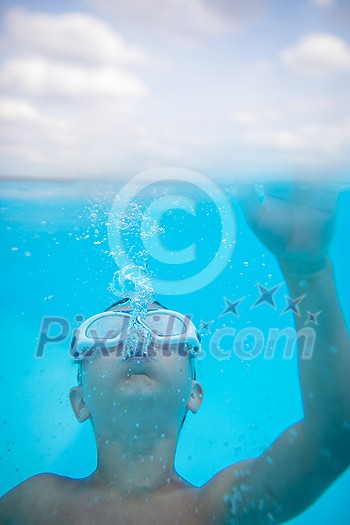 Cute little boy in a swimming pool Cute little boy in a swimming pool