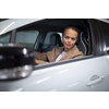 Underground parking/garage (shallow DOF; color toned image) - young woman with her car in the underground parking