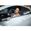 Underground parking/garage (shallow DOF; color toned image) - young woman with her car in the underground parking