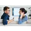 a young married couple enjoys sitting in the large living room, a young couple spending their time together
