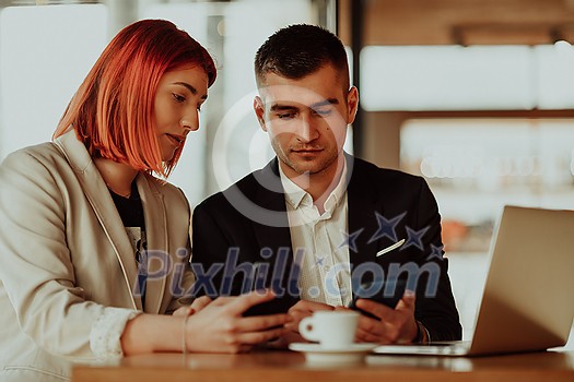 modern man and woman use modern devices, laptop, tablet, and smartphone and arrange new projects for the job modern man and woman use modern devices, laptop, tablet, and smartphone and arrange new projects for the job