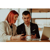 modern man and woman use modern devices, laptop, tablet, and smartphone and arrange new projects for the job
