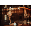a businesswoman sitting in a cafe on a break and using a tablet 