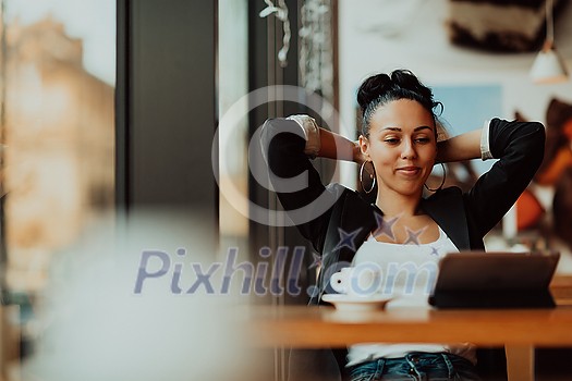 a businesswoman sitting in a cafe on a break and using a tablet a businesswoman sitting in a cafe on a break and using a tablet