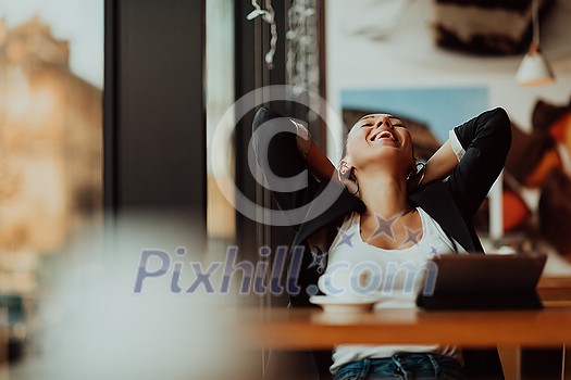 a businesswoman sitting in a cafe on a break and using a tablet a businesswoman sitting in a cafe on a break and using a tablet