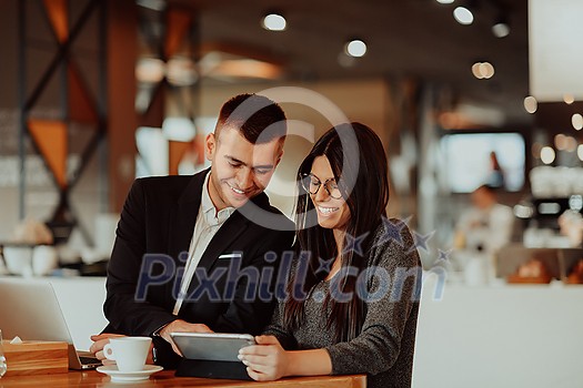modern man and woman use modern devices, laptop, tablet and smartphone and arrange new projects for the job modern man and woman use modern devices, laptop, tablet and smartphone and arrange new projects for the job
