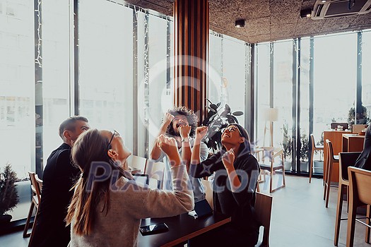 group of businessmen with their hands up celebrate successful business group of businessmen with their hands up celebrate successful business