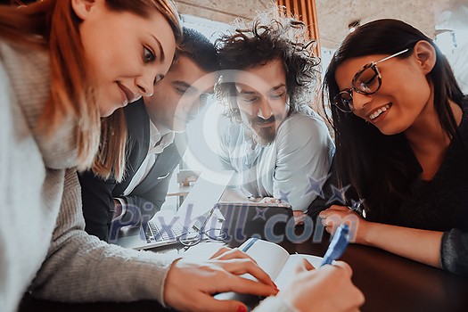 an entertaining portrait of young entrepreneurs sitting in a modern office and using modern devices an entertaining portrait of young entrepreneurs sitting in a modern office and using modern devices