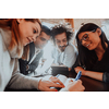 an entertaining portrait of young entrepreneurs sitting in a modern office and using modern devices