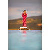Little girl on a pool's edge, learning to swim and dive. Swimming with kids. Healthy sport activity for children. Sun protection. Water fun.