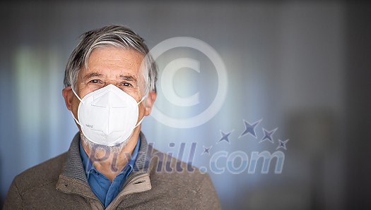 Senior man wearing a facemask during coronavirus and flu outbreak. Virus and illness protection, home quarantine. COVID-19 concept Senior man wearing a facemask during coronavirus and flu outbreak. Virus and illness protection, home quarantine. COVID-19 concept