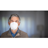 Senior man wearing  a facemask during coronavirus and flu outbreak. Virus and illness protection, home quarantine. COVID-19 concept