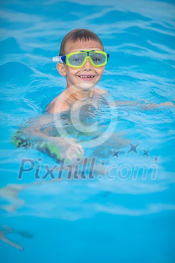 Cute little boy in a swimming pool Cute little boy in a swimming pool