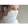 Young woman wearing a face mask during coronavirus and flu outbreak. Virus and illness protection, home quarantine. COVID-19 concept
