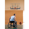 a war invalid in a wheelchair train with a ball at a basketball club in training with professional sports equipment for the disabled. the concept of sport for people with disabilities. High quality photo