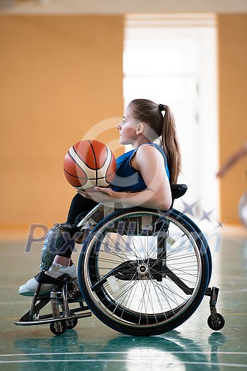 photo of the basketball team of war invalids with professional sports equipment for people with disabilities on the basketball court. High quality photo photo of the basketball team of war invalids with professional sports equipment for people with disabilities on the basketball court. High quality photo